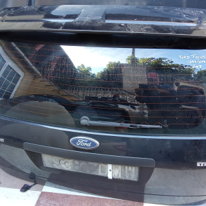 TAMPA MALA FORD FOCUS II CARRINHA 2006